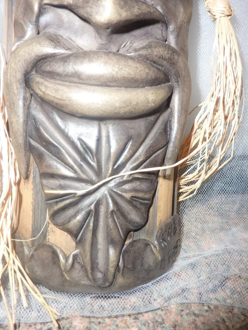 Clay mask on wood. Size 12 x 4 1/2 x 2 1/2 inches by artist Krisna Brasil